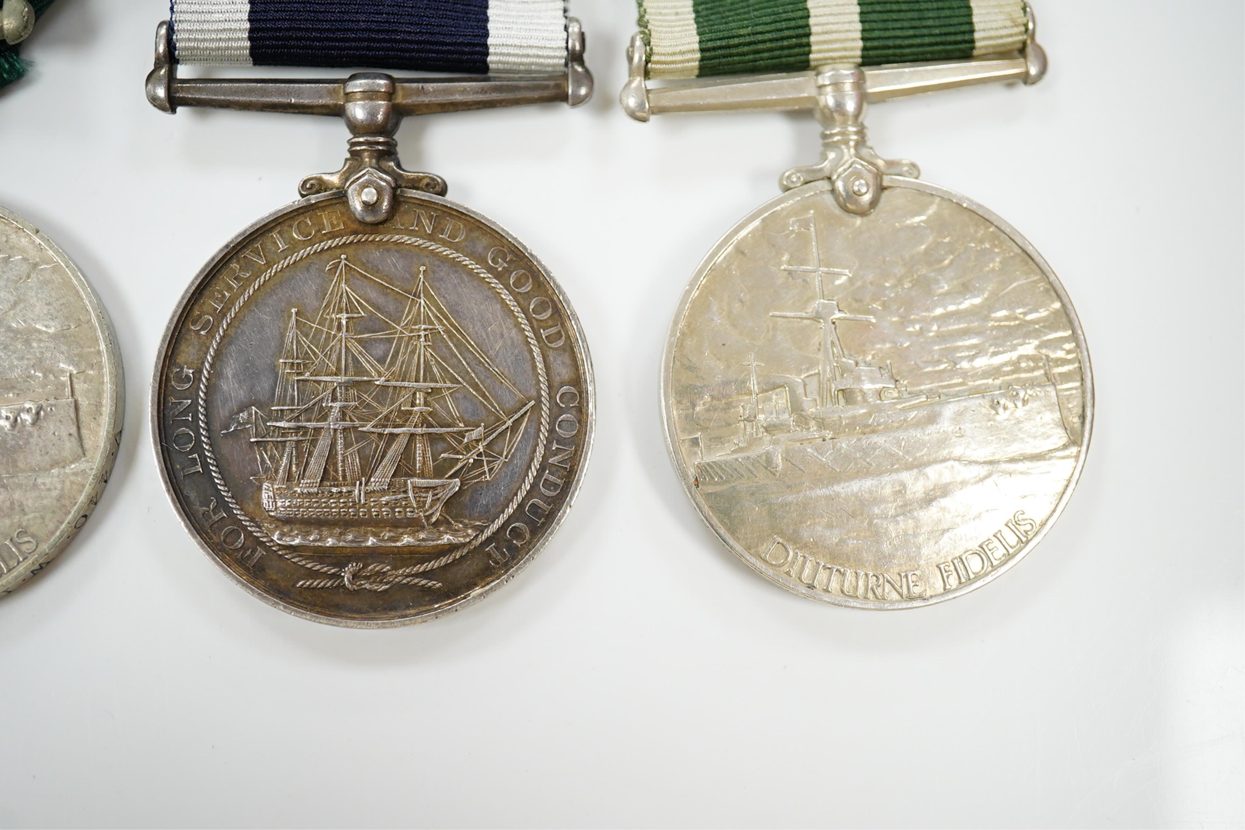 Four assorted Naval service medals; EVII Royal Naval Reserve LSGC to V.440. W.Lewis, STO.RNR.; GV Royal Fleet Reserve LSGC unnamed; GV RNLSGC (renamed) to J,87119 R.S. J.West. A.B.H.M.S.Victory; GV RNRLSGC to 1361V W.H.J